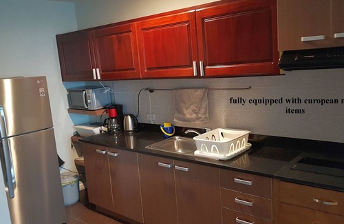 Lapu-Lapu Condo | new Lux. 2BR condo + 2 pools, woow oceanviews, Gym, Beach, behind Mactan Newtown