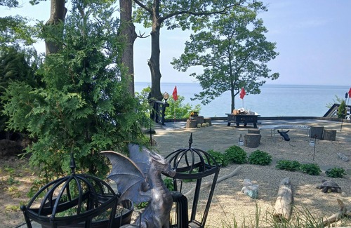 Fennville Cottage | NEW premium charm in this 3BR cottage 150 ft of private lake frontage boatdock
