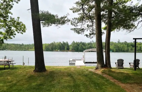 Lake Tomahawk House | NEW! Renovated Bungalow steps from Lake Tomahawk - King Bed, Dock Space, Firepit