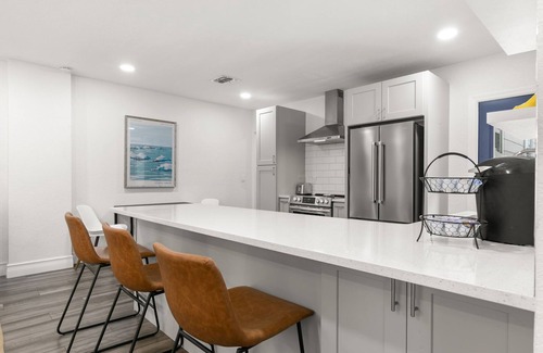 Courier City - Oscawana Apartment | NEW! SoHo Sanctuary - Gorgeous Apartment Steps to S Howard Ave with Fenced Yard