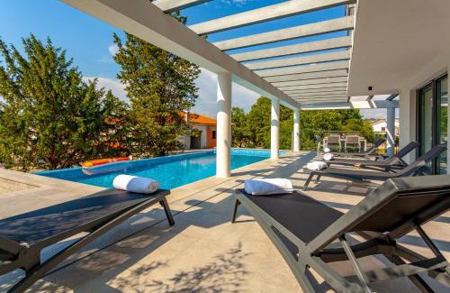 Malinska-Dubasnica Villa | New villa with large pool, sea view, 300 m from the beach - by TRAVELER tourist agency Krk - ID 2191