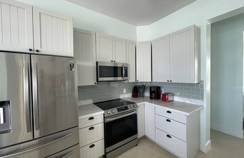 Treasure Cay House | Newly Remodeled Home with Pool on the Harbor with a Beach view an a 22x40 dock.