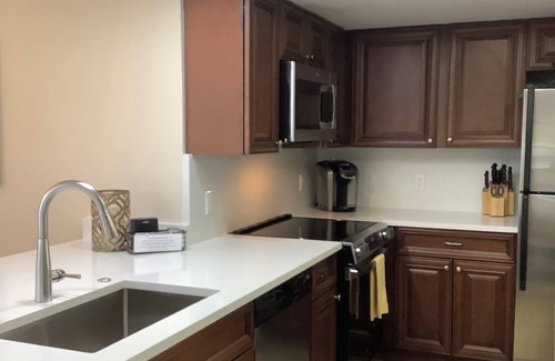 Bonita Bay Condo | Newly Renovated Corner Unit. Lake Views. Shuttle to Beach. Heated Pool/Spa