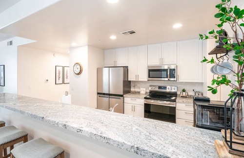 Fox Crossing House | NEWLY RENOVATED Light and bright waterfront townhome in Chandler.