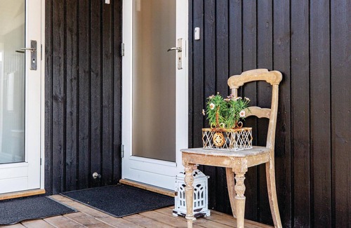 Sklskr House | Nice and bright cottage with a kitchen that is partly open to the dining and living room.
