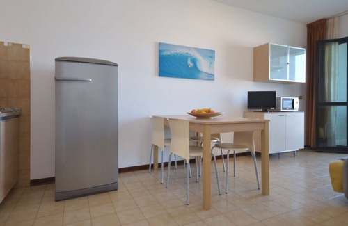 Lignano Sabbiadoro Apartment | Nice apartment for 4 guests with pool, A/C, TV, terrace and pets allowed
