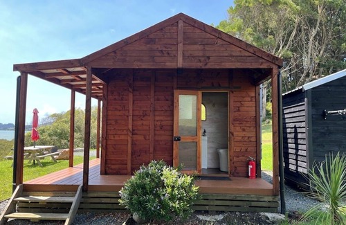 Mangonui Cabin | No other quite like it! Waterfront private cabin stay.