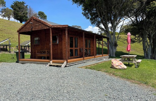 Mangonui Cabin | No other quite like it! Waterfront private cabin stay.