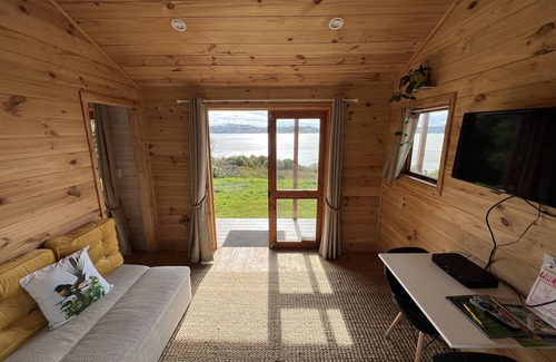 Mangonui Cabin | No other quite like it! Waterfront private cabin stay.