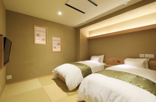 Yudanaka Shibu Onsen Hotel | Nonsmoking Japanesestyle room with openair bath Issanoma River view | Room only /Shimotakaigun Nagano