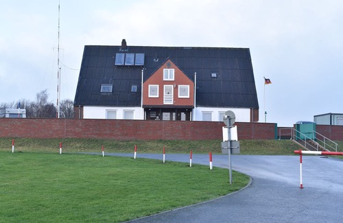 Neufeld House | Nordseehaus Op'n'Diek on the dike overlooking the small Priel harbor.