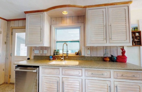 New Smyrna Beach House | North Beach rental! 2 Bedroom, 1 flex room and 1 bath home, just one block from beach access and Grayce Barck Park with nature trails.