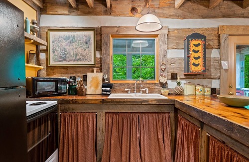 Gnaw Bone Cabin | Nostalgic log cabin antique furnishings nestled in wooded serenity Pet Friendly!