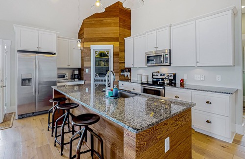 Carova Beach House | Ocean-view home with wrap-around deck, beach access, outdoor shower & cornhole
