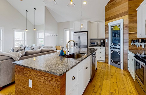 Carova Beach House | Ocean-view home with wrap-around deck, beach access, outdoor shower & cornhole