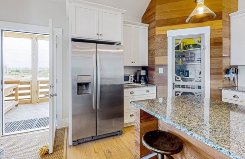Carova Beach House | Ocean-view home with wrap-around deck, beach access, outdoor shower & cornhole