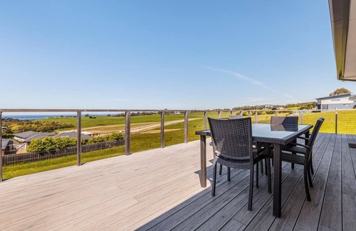 Lakes Entrance House | Ocean Vista - A view of the ocean over the large backyard