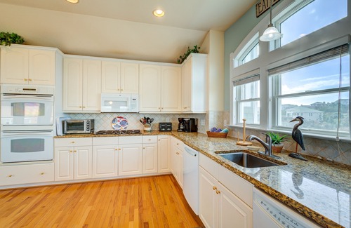 Carolina Dunes House | Oceanfront home with private heated pool complete with swim up bar and in-pool seating