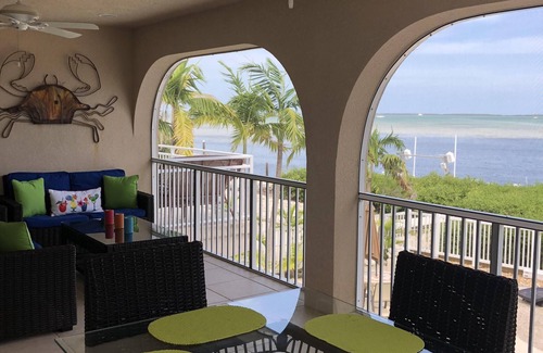 Breezeswept Beach Estates House | Oceanfront Rental With Heated Pool, Dock & Tiki Hut