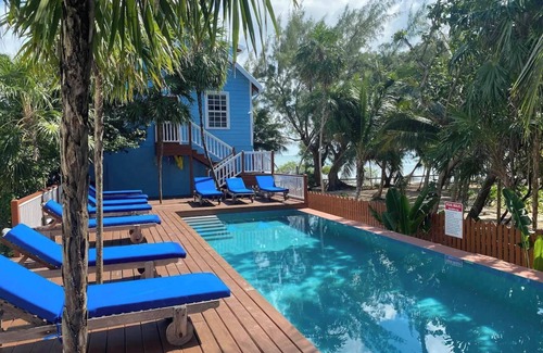 Caye Caulker Apartment | Oceanfront Unit w/dock/pool/AC-free paddle boards -2 bed, 1 bath sleeps 6