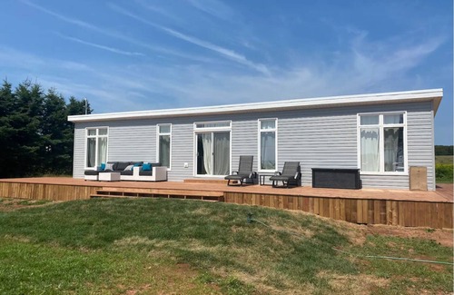 DeSable Cottage | Oceanview haven- steps to the beach in this 2bedroom cottage with large deck