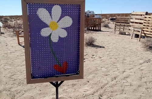 Joshua Tree RV Rental | Off grid camping, bring tents or camper van. The only frill is a clean outhouse!