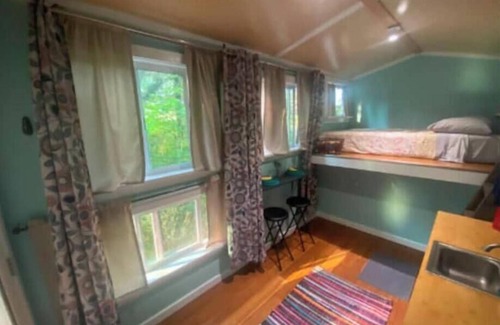 Travelers Rest Cabin | Off-Grid Tiny Home Cozy Cabin on Wheels