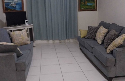 Below Rock Apartment | Oistins 2 Bed Apartment with AC Near Miami Beach & Oistins.