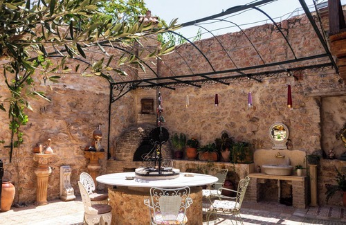 Kerameikos House | Olvion House: rustic stone retreat in Athens with a cozy private courtyard.