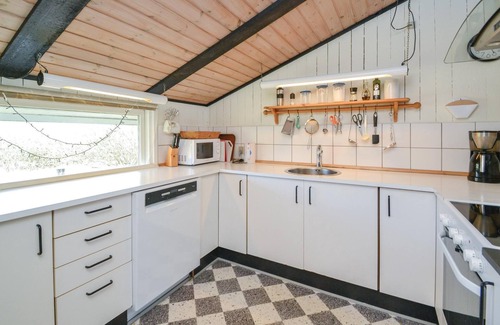 Rindby Strand House | On an attractive dune plot in Rindby lies this well-maintained, beautiful summer house, which is exc