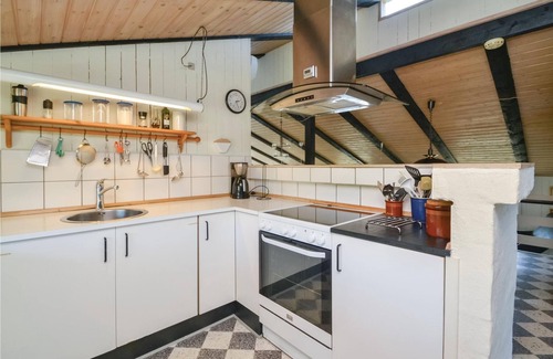 Rindby Strand House | On an attractive dune plot in Rindby lies this well-maintained, beautiful summer house, which is exc