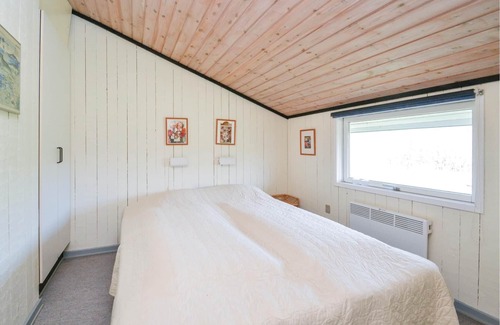 Rindby Strand House | On an attractive dune plot in Rindby lies this well-maintained, beautiful summer house, which is exc