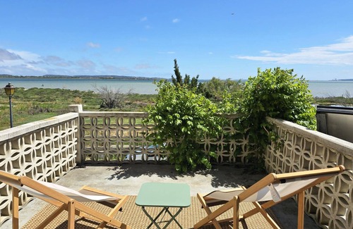 Bages House | On the edge of a salt pond, house with terrace facing the water and pink flamingos