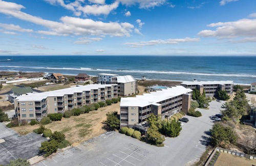Duck Condo | Open and airy Colony by the Sea condo with beach-inspired décor and community amenities
