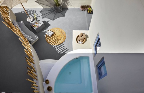 Pyrgos Apartment | Outdoor hot tub, Caldera and sunset views