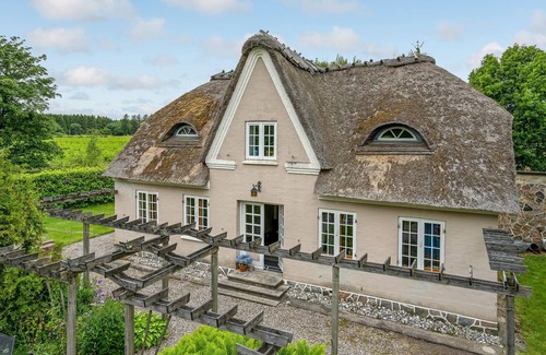 Krusaa House | Outside Krusau welcomes you this beautiful thatched house.