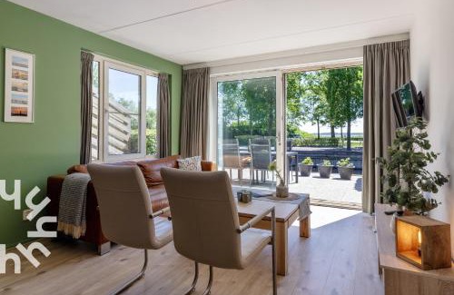 Sint Jansklooster House | OV306 - Very nice and spacious 4 person apartment near Giethoorn on the water and private dock
