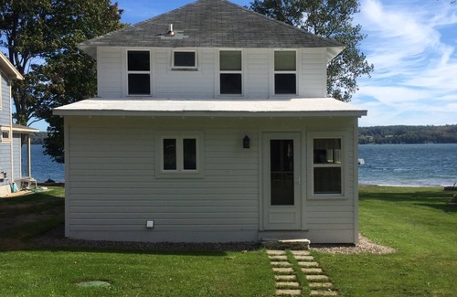Auburn Cottage | Owasco Lake front seasonal cottage with level yard and beach