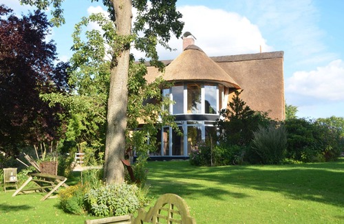 Grebin Apartment | Owl tower - thatched aspen house