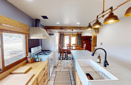Spanish Valley Cabin | Pack Creek ~ Meadow House: Boho mountain oasis with fireplace, patio views, and stargazing bed