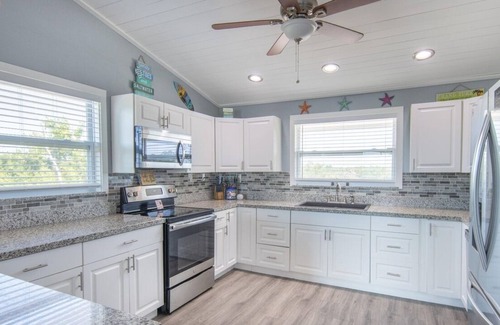 Port Pine Heights House | PADGETT PARADISE with Two Boat Slips with Filet Table. POOL