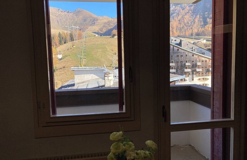 Foppolo Apartment | Panorama of Foppolo, the mountains and the slopes in the morning sun
