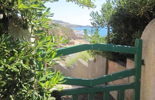 Porto Alabe Villa | Panoramic sea front housewith garden and beach directly below