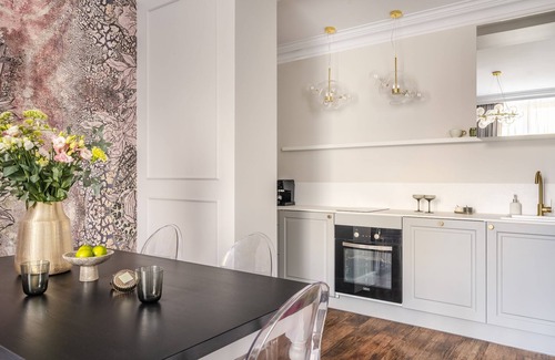 Stare Miasto Apartment | Parisian-chic meets Kraków with soft lighting
