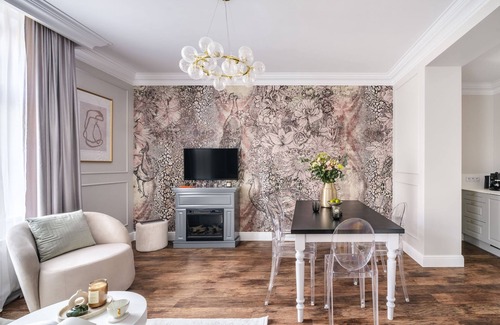 Stare Miasto Apartment | Parisian-chic meets Kraków with soft lighting