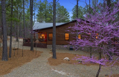 Broken Bow Cabin | Patio in the Pines offers all of the luxuries in an absolutely stunning vacation cabin. One of the outstanding features is a HUGE 1,200 square foot covered outdoor living space with soaring ceilings, adorned with a wine barrel chandelier.