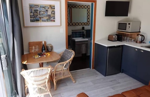 Waihi Beach Cabin | Peace of Bali 1 bed cabin set in a tropical garden with WiFi & AC in Waihi Beach