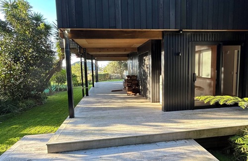 Matapouri House | Peaceful 4-Bedroom Beach House across road from estuary & fantastic beach views