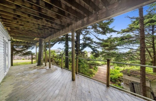 Cape Meares Cottage | Peaceful 4BR Cape Meares Home | Ocean Views, Forest Setting, Wraparound Deck + King Bed