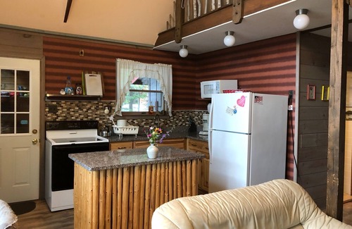 Rangeley Plantation Cabin | Peaceful, Secluded Waterfront Cottage with Sandy Beach
